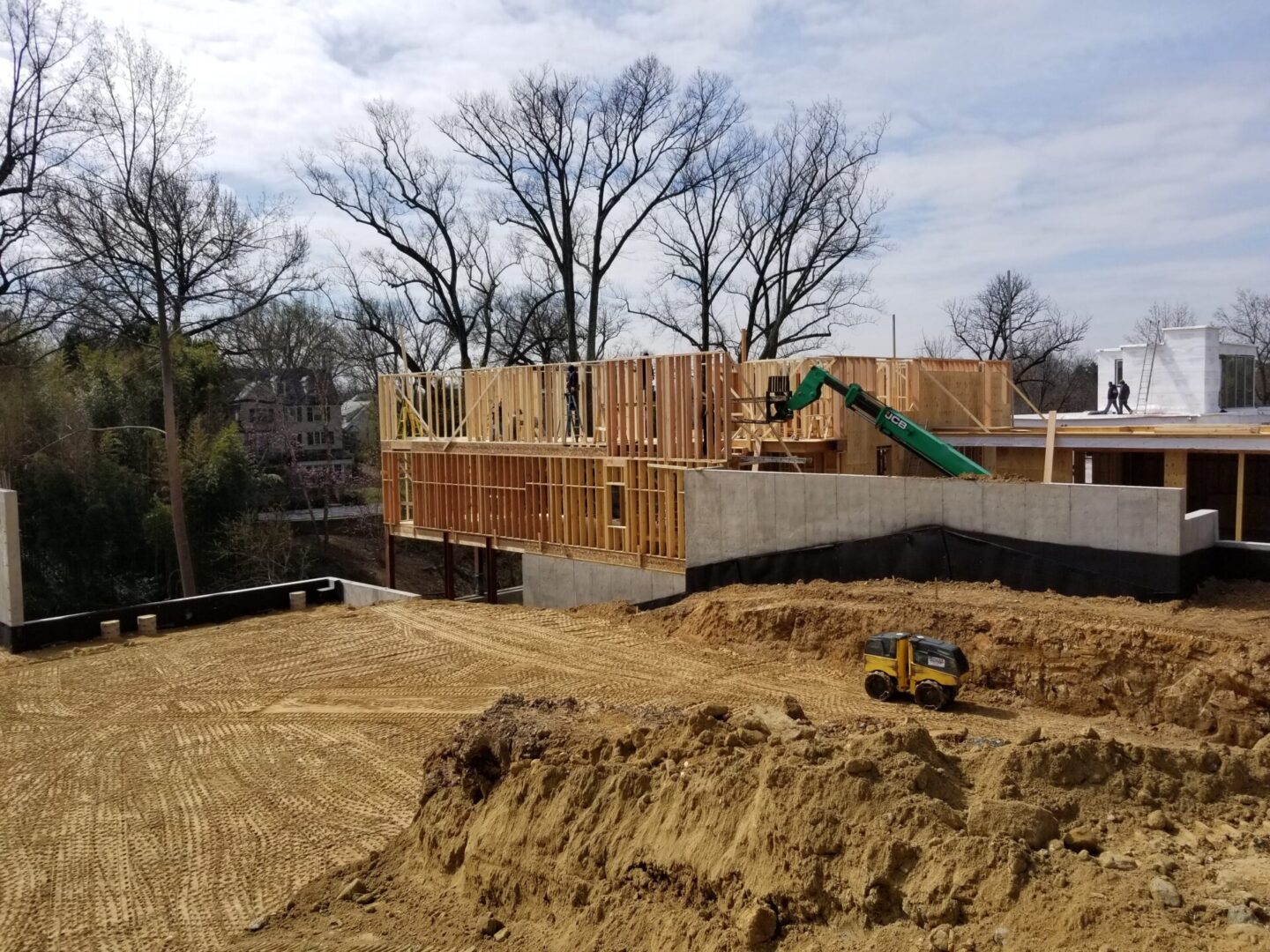 A crane lifting up wood materials for the building