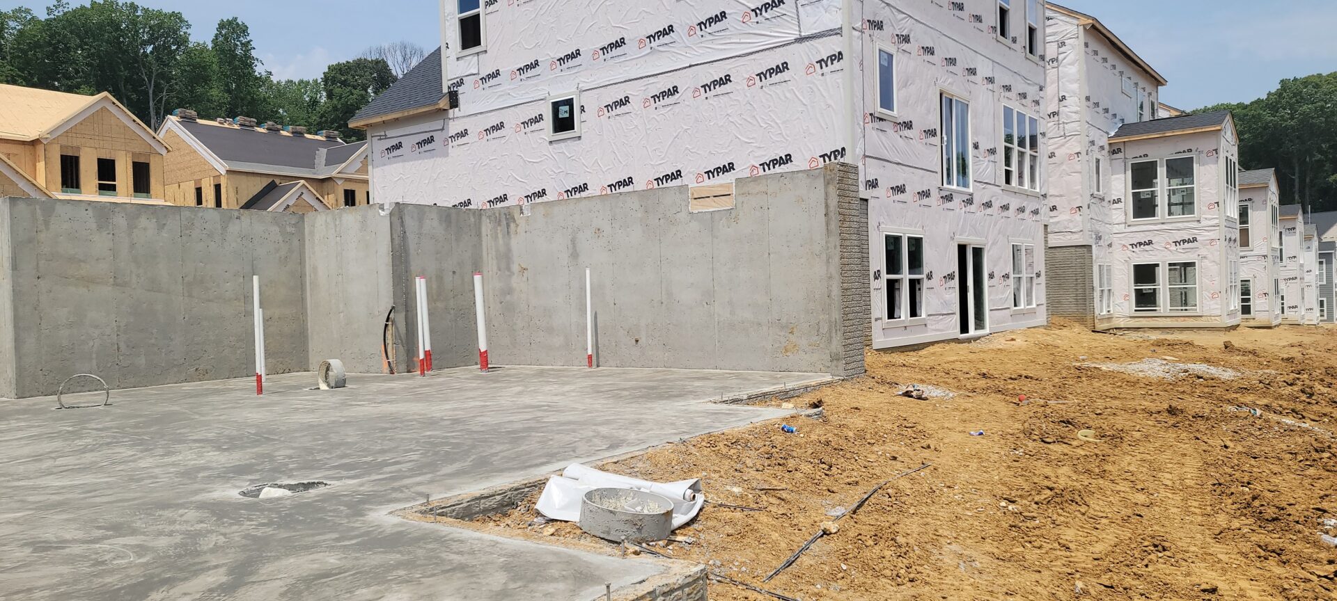 Concrete walls next to new buildings